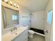 A bright bathroom featuring tile floors, a walk-in shower, and modern fixtures at 8480 Adams Way, Denver, CO 80229