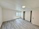 Comfortable bedroom with ample closet space, neutral paint, and contemporary gray flooring at 8480 Adams Way, Denver, CO 80229