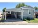 Charming single-story home with a covered parking area and well-maintained landscaping at 8480 Adams Way, Denver, CO 80229