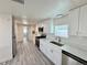 Modern kitchen with white cabinetry, stainless steel appliances, and sleek countertops at 8480 Adams Way, Denver, CO 80229