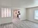 Bright living space offering an open view into the kitchen at 8480 Adams Way, Denver, CO 80229