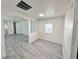 Bright living room with updated flooring, neutral walls, and plenty of natural light at 8480 Adams Way, Denver, CO 80229