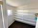Pantry with ample shelving and a window providing natural light for storage at 8480 Adams Way, Denver, CO 80229