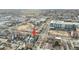 Aerial view of house near school, field, and busy street at 2636 W 27Th Ave, Denver, CO 80211