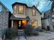 Charming two-story home featuring stucco siding, a covered front porch, and a well-manicured front yard at 2636 W 27Th Ave, Denver, CO 80211