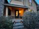 Inviting front porch featuring stone accents, a covered entryway, and decorative lanterns for cozy illumination at 2636 W 27Th Ave, Denver, CO 80211