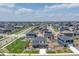A scenic aerial view of a vast neighborhood showing the orderly layout of homes, streets, and green spaces at 13315 Xanthia St, Thornton, CO 80602