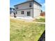 The backyard features a concrete patio, new lawn, and a wood fence at 13315 Xanthia St, Thornton, CO 80602