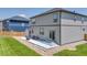 Beautiful backyard features a modern patio, a green lawn, and a partial fence for privacy at 13315 Xanthia St, Thornton, CO 80602