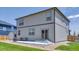Backyard features a concrete patio, a grassy lawn, and a privacy fence at 13315 Xanthia St, Thornton, CO 80602