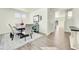 Dining room with hardwood floors, elegant table, chairs, and modern decor at 13315 Xanthia St, Thornton, CO 80602