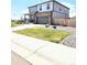 Charming two-story house featuring a well-maintained lawn, covered porch, and two car garage at 13315 Xanthia St, Thornton, CO 80602