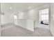 Upstairs hallway with carpet floors leads to various rooms, creating a seamless flow throughout the home at 13315 Xanthia St, Thornton, CO 80602