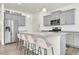 Modern kitchen showcasing granite countertops, stainless steel appliances, and an island with seating at 13315 Xanthia St, Thornton, CO 80602