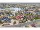 Serene community featuring waterfront homes surrounded by lush greenery and picturesque landscapes at 16 Blue Heron Dr, Thornton, CO 80241