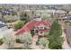 Stunning aerial view of the estate showing its meticulous landscaping and proximity to a scenic lake at 16 Blue Heron Dr, Thornton, CO 80241