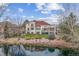 Large backyard with mature landscaping, a stone fire pit and a beautiful water feature at 16 Blue Heron Dr, Thornton, CO 80241