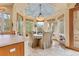 Charming breakfast nook with a bay window, decorative ceiling, and cozy seating at 16 Blue Heron Dr, Thornton, CO 80241