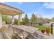 Relax on the outdoor deck with wrought iron seating and view of the beautiful landscape at 16 Blue Heron Dr, Thornton, CO 80241