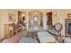 Elegant foyer with tile flooring, staircase, fireplace, decorative accents, and access to other areas at 16 Blue Heron Dr, Thornton, CO 80241