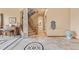 Grand foyer featuring a staircase, tile flooring, and decorative accents and lighting at 16 Blue Heron Dr, Thornton, CO 80241