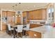 Spacious kitchen with a central island, granite countertops, custom cabinets, and stainless steel appliances at 16 Blue Heron Dr, Thornton, CO 80241