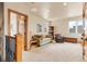 Bright living room with natural lighting, built-in bookcase, and comfortable seating arrangement at 16 Blue Heron Dr, Thornton, CO 80241