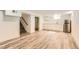 Finished basement featuring wood-look floors, wet bar and neutral colors at 695 S Quitman St, Denver, CO 80219