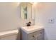 Neat and clean bathroom featuring a white vanity and modern fixtures at 695 S Quitman St, Denver, CO 80219