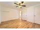 Spacious bedroom featuring hardwood floors, a ceiling fan, and a standard closet at 695 S Quitman St, Denver, CO 80219
