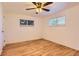 Light and bright bedroom with wood flooring and ceiling fan with lighting at 695 S Quitman St, Denver, CO 80219
