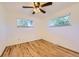 Light and bright bedroom with hardwood flooring and two windows at 695 S Quitman St, Denver, CO 80219