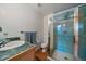 Bathroom with green tiles, a sink, a toilet, and a shower at 26452 Wolverine Trl, Evergreen, CO 80439