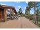 Large deck with a grill and a beautiful view at 26452 Wolverine Trl, Evergreen, CO 80439