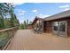Spacious deck with seating and mountain views, perfect for outdoor entertaining and enjoying nature at 26452 Wolverine Trl, Evergreen, CO 80439