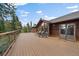 Spacious deck with seating and mountain views, perfect for outdoor entertaining and enjoying nature at 26452 Wolverine Trl, Evergreen, CO 80439
