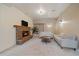 The living room features a beautiful stone fireplace, a plant, and two sofas at 26452 Wolverine Trl, Evergreen, CO 80439