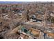 Aerial view of the home with the city skyline in the distance at 1804 S Corona St, Denver, CO 80210