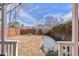 Expansive fenced backyard with a small bench and foliage at 1804 S Corona St, Denver, CO 80210