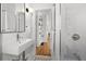 Bright bathroom featuring modern fixtures, subway tile, and shower with glass doors at 1804 S Corona St, Denver, CO 80210