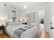 Inviting bedroom with natural light, hardwood floors, and a closet at 1804 S Corona St, Denver, CO 80210