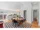 Bright dining area with a round table, stylish chairs, and natural light at 1804 S Corona St, Denver, CO 80210