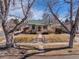 The inviting home features a manicured lawn, inviting front steps, and lovely landscaping at 1804 S Corona St, Denver, CO 80210