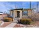 Inviting front porch with potted plants and charming curb appeal at 1804 S Corona St, Denver, CO 80210