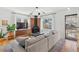 Bright living room featuring a brick fireplace, modern lighting, and comfortable seating at 1804 S Corona St, Denver, CO 80210