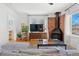 Bright living room with modern fireplace, stylish furnishings, and hardwood floors at 1804 S Corona St, Denver, CO 80210