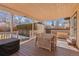 Covered back patio featuring natural wood dining table set at 1804 S Corona St, Denver, CO 80210