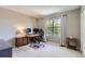 Bright bedroom with large window, desk, and comfortable office setup at 10330 Lions Path, Lone Tree, CO 80124