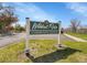Wildcat Ridge Community Center sign with well-manicured lawn and trees, and a clear blue sky at 10330 Lions Path, Lone Tree, CO 80124
