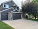 Charming two-story home featuring a spacious two-car garage, well-manicured lawn and mature trees at 10330 Lions Path, Lone Tree, CO 80124